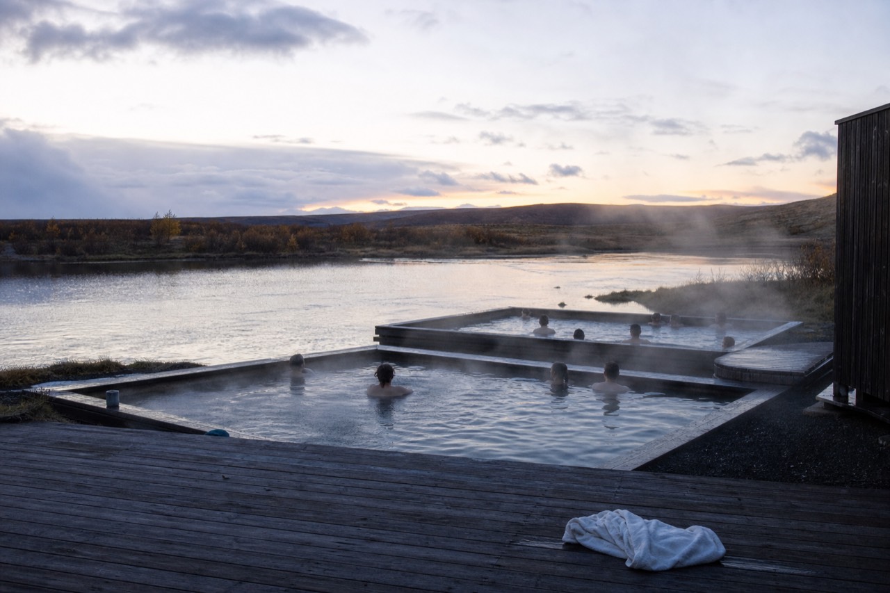 Geothermal pools floating on a lake in East Iceland at dusk